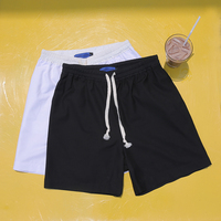 【折扣专区】 夏天男白色黑色沙滩裤五分热裤情侣纯色宽松短裤潮